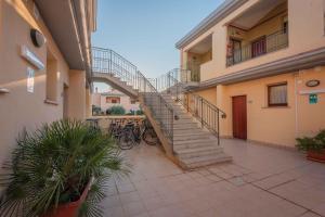 a staircase in a building with bikes parked next to it at Holiday Homes Villasimius - Sardinien 33710 in Villasimius