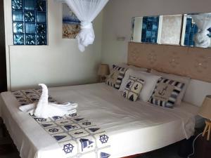 Postel nebo postele na pokoji v ubytování Coco Bay Villa