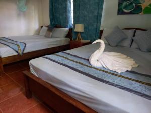 Postel nebo postele na pokoji v ubytování Coco Bay Villa