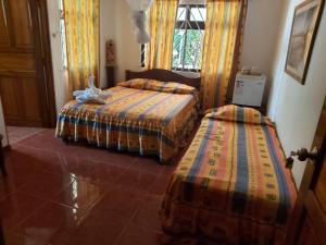 Postel nebo postele na pokoji v ubytování Coco Bay Villa
