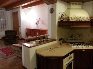 a kitchen with a stove and a counter top at Holiday home in Velo d Astico 25854 in Arsiero