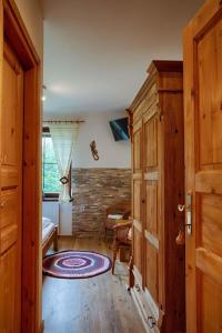 a hallway with a wooden door and a room at Holiday home in Harrachov 33511 in Harrachov