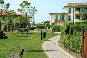 A garden outside Apartments in Caorle 24705