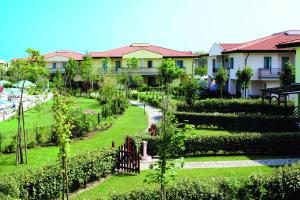 A garden outside Apartments in Caorle 24705