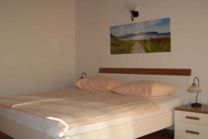 a bedroom with a bed with two pillows on it at Apartment in Punat - Insel Krk 13351 in Punat