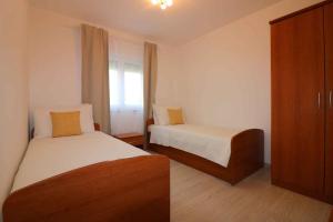 Postel nebo postele na pokoji v ubytování Holiday Homes in Porec - Istrien 10234