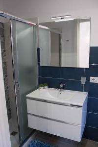 a bathroom with a sink and a shower and a mirror at Studio in Siracusa/Insel Sizilien 34738 in Siracusa