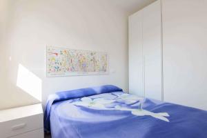 Een bed of bedden in een kamer bij Apartments in Lignano Sabbiadoro 21788