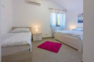 Postel nebo postele na pokoji v ubytování Apartment in Crikvenica 34970