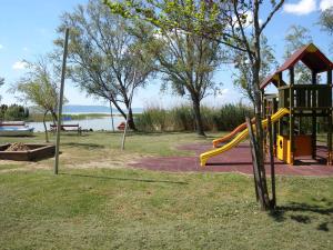 a park with a playground with a slide at Holiday home in Balatonfenyves 34651 in Balatonfenyves