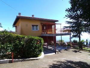 a house with a balcony on the side of it at Apartment in Rijeka 34082 in Rijeka