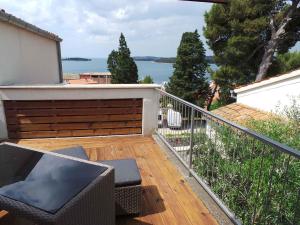 a balcony with a view of the water at Apartments in Rovinj/Istrien 34602 in Rovinj