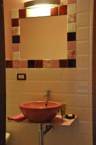 a bathroom with a copper bowl sink on a wall at Apartment in Vicchio - Toskana 31169 in Vicchio +14 photos