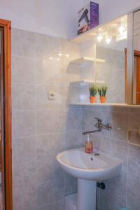 a bathroom with a sink and a shower at Apartments in Vantacici/Insel Krk 13154 in Vantačići