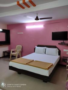 Posteľ alebo postele v izbe v ubytovaní Hotel DKR Residency