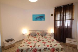 a bedroom with a bed with a dolphin on it at Apartments in Silo/Insel Krk 26753 in Šilo