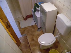 a small bathroom with a toilet and a sink at Holiday home in Lopar/Insel Rab 17776 in Lopar