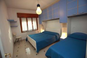 Ένα ή περισσότερα κρεβάτια σε δωμάτιο στο Two-Bedroom Apartment in Rosolina Mare - Venetien 25037
