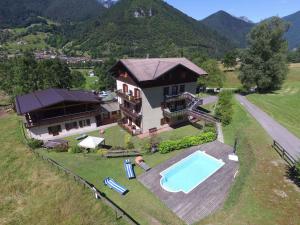 an aerial view of a house with a swimming pool at Holiday Homes in Tiarno di Sotto/Ledrosee 22703 in Tiarno di Sotto