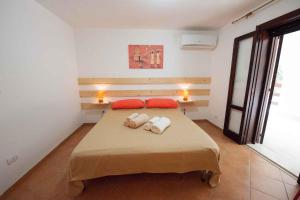a bedroom with a bed with two towels on it at Apartment Siracusa/Insel Sizilien 23389 in Ognina