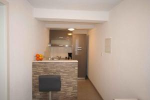 a kitchen with a counter and a sink in a room at Apartment in Silo with One-Bedroom 1 in Šilo