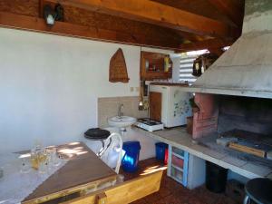 a small kitchen with a stove and a sink at Apartment in Fazana/Istrien 8621 in Valbandon