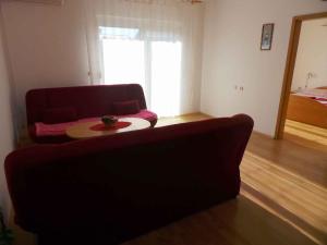 a living room with a couch and a table at Apartment Valbandon, Istria 11 in Fondole