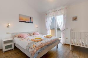 Łóżko lub łóżka w pokoju w obiekcie Holiday Home Veronika