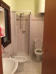 a bathroom with a shower and a toilet and a sink at Studio in Letojanni/Sizilien 23302 in Letojanni