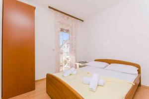 Postel nebo postele na pokoji v ubytování Apartment in Stari Grad - Insel Hvar 6321