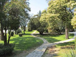 a path through a park with trees and grass at Holiday home in Pula/Istrien 17365 in Štinjan