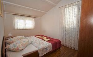 Ένα ή περισσότερα κρεβάτια σε δωμάτιο στο Apartment Medulin 32
