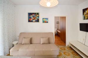 a living room with a couch and a television at Pula Apartment 11 in Veruda