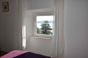 En eller flere senge i et værelse på Biograd na Moru Apartment 1