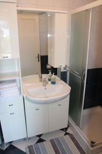a bathroom with a white sink and a shower at Apartment in Silo/Insel Krk 14603 in Šilo