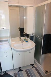 a bathroom with a white sink and a shower at Apartment in Silo - Insel Krk 14603 in Šilo