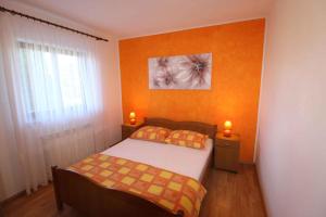 a small bedroom with a bed and a window at House and Apartments in Labin 8758 in Labin +34 photos