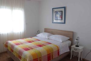 Postel nebo postele na pokoji v ubytování Apartment Slatine 6
