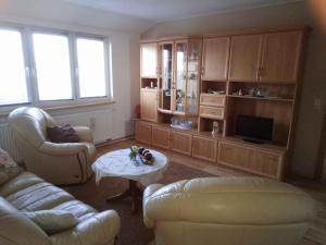 a living room with a couch and a coffee table at Apartment Gingst 1 in Gingst