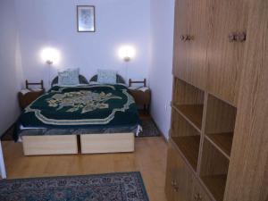 a bedroom with a bed and a dresser in it at Apartment in Zalakaros - Thermalbad 20682 in Zalakaros +15 photos