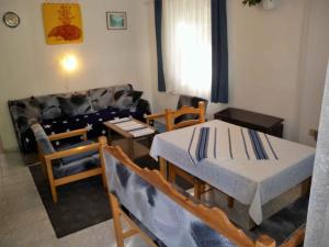 a living room with two beds and a couch at Apartment in Zalakaros - Thermalbad 20682 in Zalakaros