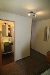 a room with a bathroom with a sink and a mirror at Apartment Todtmoos 2 in Todtmoos