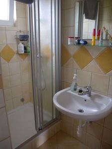 a bathroom with a sink and a shower at Holiday home in Balatonfenyves 18412 in Balatonfenyves