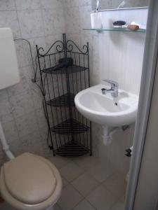 a bathroom with a toilet and a sink at Holiday home in Balatonfenyves 18412 in Balatonfenyves