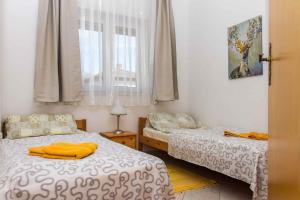 Posteľ alebo postele v izbe v ubytovaní Holiday home in Balatonmariafürdo 19492 + 9 fotografií