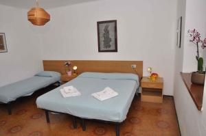 a hospital room with two beds and a table at Apartment Pieve di Ledro 3 in Ledro