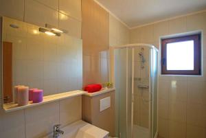 a bathroom with a shower and a sink at Apartment Rabac 28 in Rabac