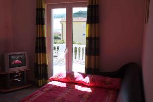 Postel nebo postele na pokoji v ubytování Apartment Povljana 3