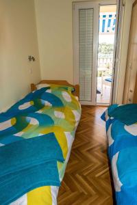 Postel nebo postele na pokoji v ubytování Apartment Banjol 10