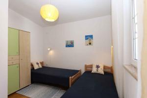 Postel nebo postele na pokoji v ubytování Apartment in Silo - Insel Krk 13416